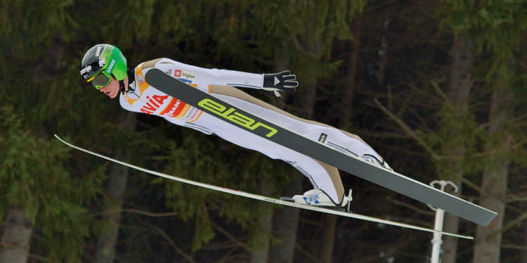 how is it possible for ski jumpers to stay in the air so long and how do they train for that?