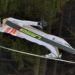 how is it possible for ski jumpers to stay in the air so long and how do they train for that?