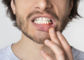 why is my gum swollen around one tooth in the back