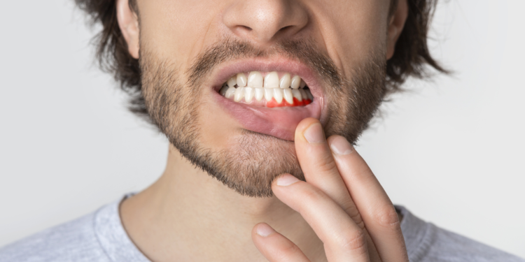 why is my gum swollen around one tooth in the back